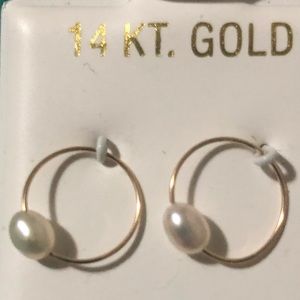 14kt solid gold and freshwater pearl hoop earrings. Never worn. Over 3/8 “